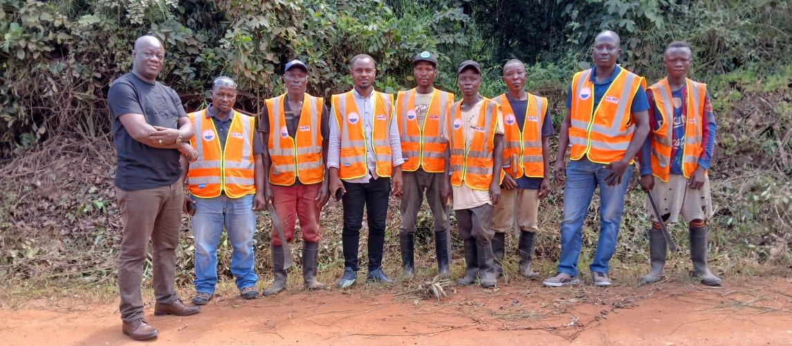 Photo credit: MIA Asst. Min. for Technical Services Orando F. Armah poses with the Road Inspection Delegation &amp; some other workers