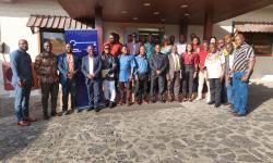 Cross section of participants posed for the press after the one-day session